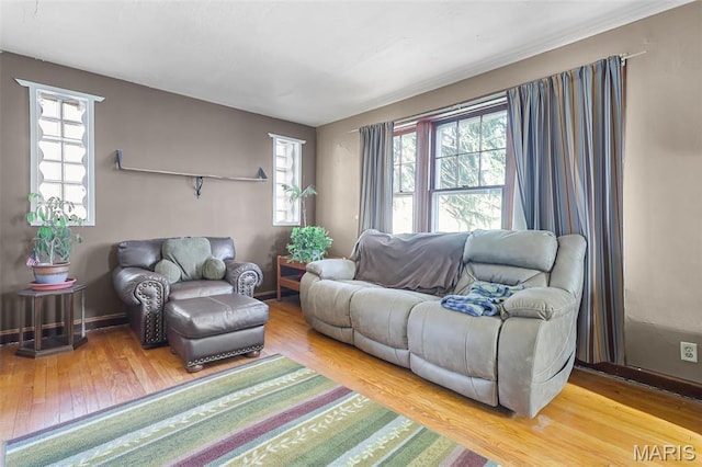 5800 Marquette Ave, Saint Louis, MO 63139 - living area featuring wood finished floors, plenty of natural light, and baseboards