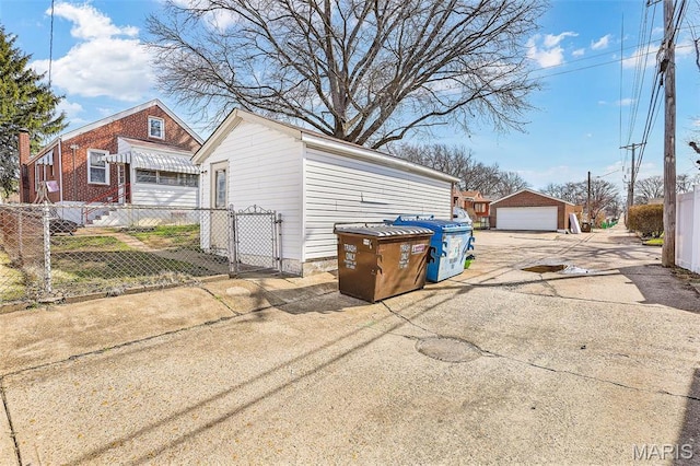 5800 Marquette Ave, Saint Louis, MO 63139 - detached garage featuring fence and a gate