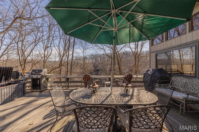 1703 Wynnbrook Woods Dr, Innsbrook, MO 63390 - wooden terrace featuring outdoor dining area and a grill