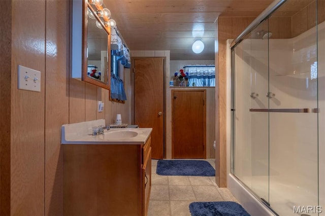 1703 Wynnbrook Woods Dr, Innsbrook, MO 63390 - bathroom featuring a shower with door, vanity, and tile patterned floors