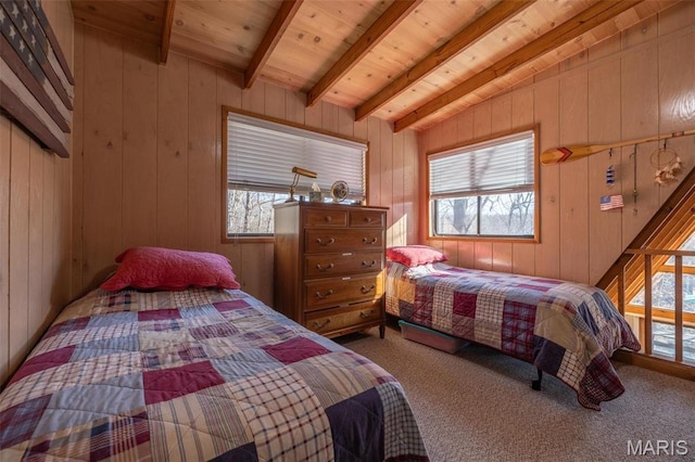 1703 Wynnbrook Woods Dr, Innsbrook, MO 63390 - bedroom with carpet floors, multiple windows, wooden walls, and wood ceiling with exposed beams
