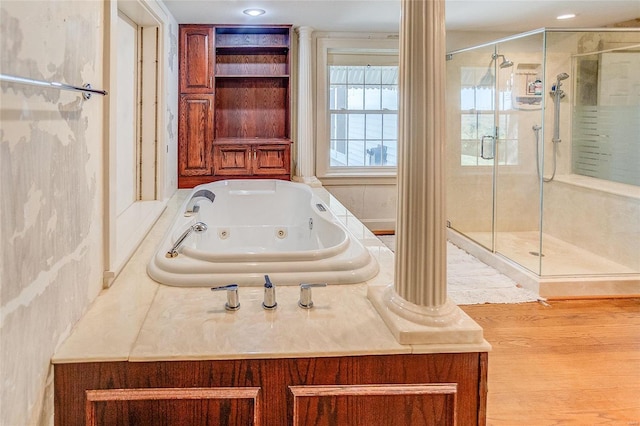 full bathroom with a stall shower and a tub with jets