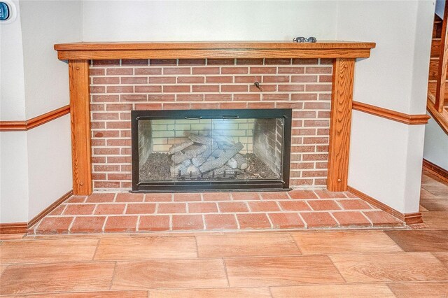 detailed view of a fireplace and baseboards