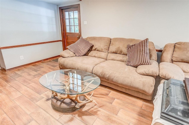 living room with wood finished floors and baseboards