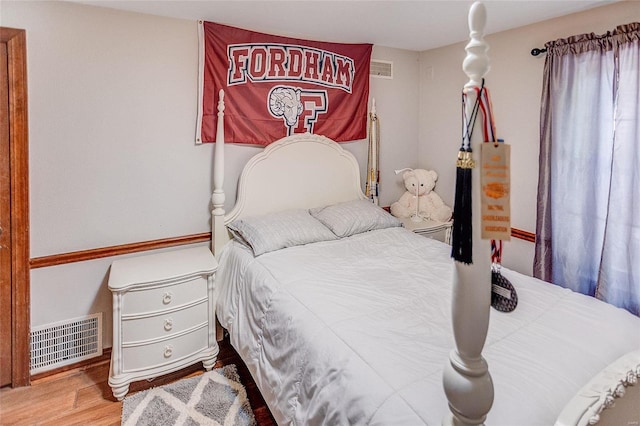 bedroom with wood finished floors