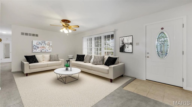 912 Salem Way, Ellisville, MO 63021 - living room featuring a ceiling fan, light colored carpet, light tile patterned flooring, and baseboards