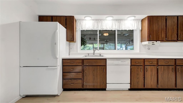 912 Salem Way, Ellisville, MO 63021 - kitchen featuring white appliances, a sink, light wood finished floors, and light countertops