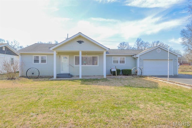 2500 Pine St, Granite City, IL 62040 - view of front of property with asphalt driveway, an attached garage, and a front lawn