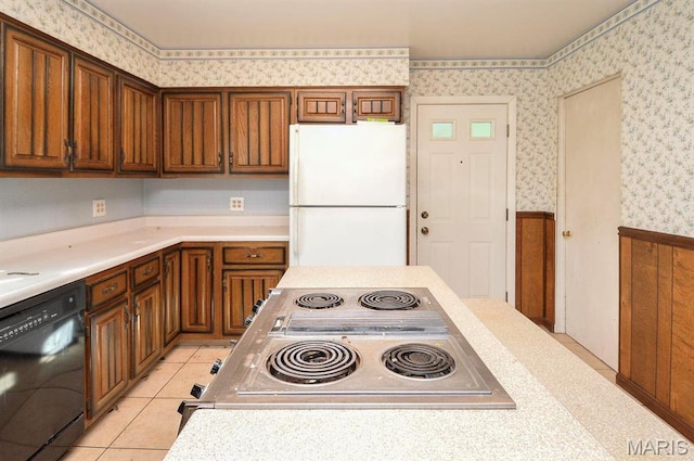 2500 Pine St, Granite City, IL 62040 - kitchen featuring freestanding refrigerator, dishwasher, wallpapered walls, stovetop with downdraft, and light countertops