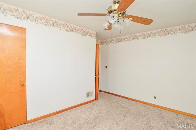 2500 Pine St, Granite City, IL 62040 - unfurnished room with light colored carpet, baseboards, and a ceiling fan
