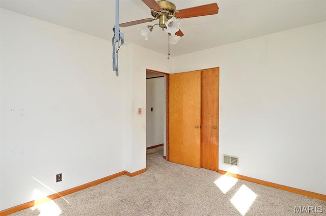 2500 Pine St, Granite City, IL 62040 - spare room featuring ceiling fan, carpet flooring, and baseboards