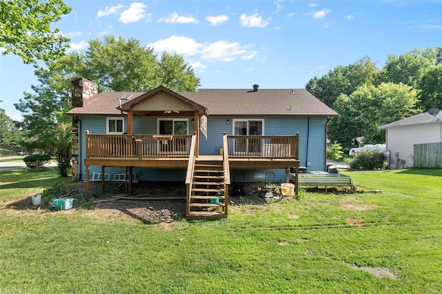 rear view of property with a deck, a chimney, a yard, and stairway