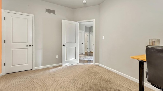 unfurnished bedroom with carpet flooring and baseboards