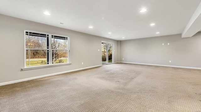 empty room with recessed lighting, carpet floors, and baseboards