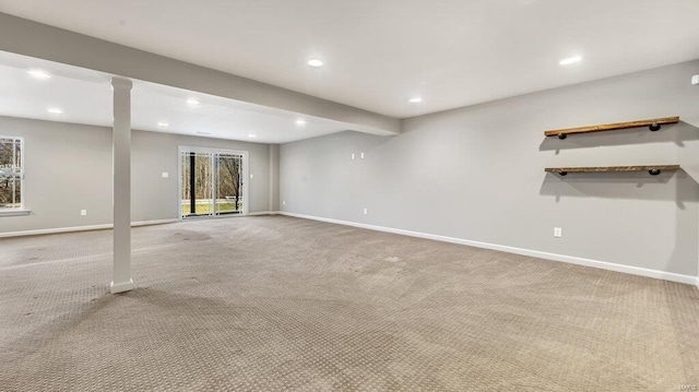 below grade area with carpet flooring, recessed lighting, and baseboards
