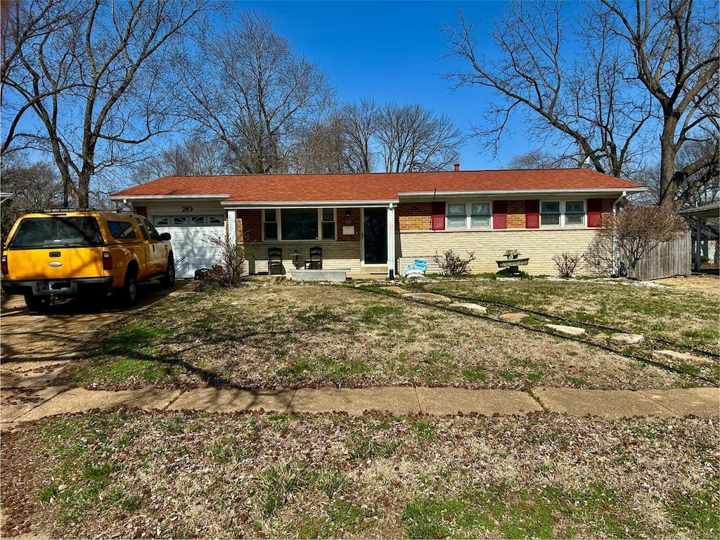 20 Hammes Dr, Florissant, MO 63031 - single story home featuring a garage, brick siding, a front yard, and driveway
