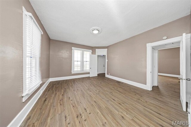 307 S State Highway 47, Warrenton, MO 63383 - empty room with baseboards and wood finished floors