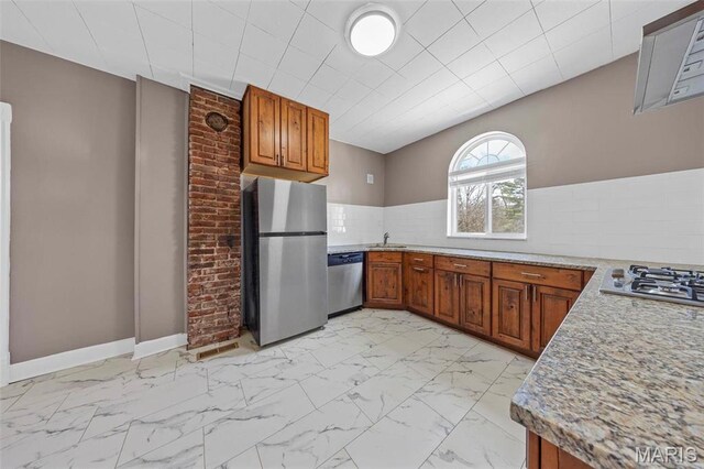 307 S State Highway 47, Warrenton, MO 63383 - kitchen with stainless steel appliances, light marble finish flooring, brown cabinets, and a sink