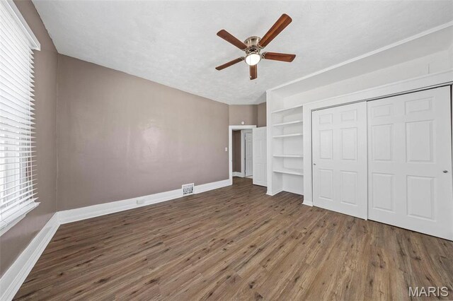 307 S State Highway 47, Warrenton, MO 63383 - unfurnished bedroom featuring wood finished floors, baseboards, and a closet