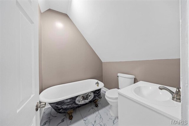 307 S State Highway 47, Warrenton, MO 63383 - bathroom with a freestanding tub, vaulted ceiling, a sink, marble finish floors, and toilet