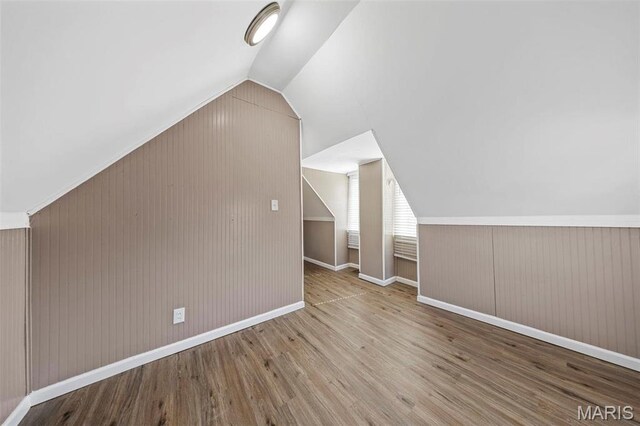 307 S State Highway 47, Warrenton, MO 63383 - additional living space featuring lofted ceiling, wood finished floors, wood walls, and baseboards