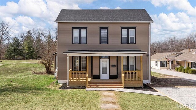 307 S State Highway 47, Warrenton, MO 63383 - traditional home featuring covered porch and a front yard