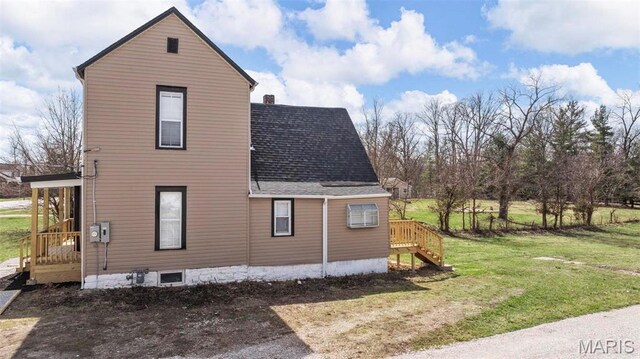 307 S State Highway 47, Warrenton, MO 63383 - view of property exterior with a shingled roof, a yard, and stairs