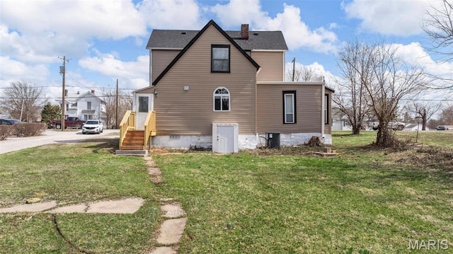 307 S State Highway 47, Warrenton, MO 63383 - view of side of property with a yard, crawl space, a chimney, and roof with shingles