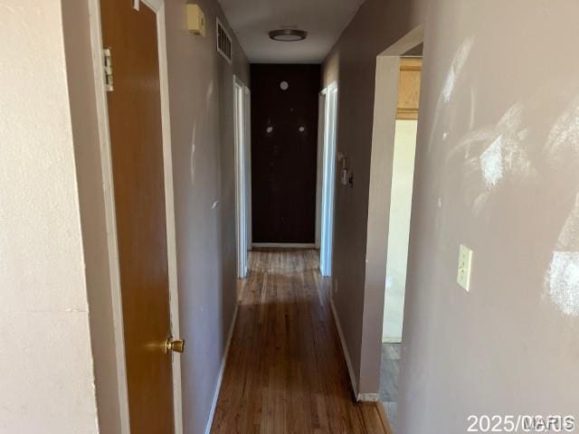 2283 Cessna Dr, Arnold, MO 63010 - hallway with wood finished floors and baseboards