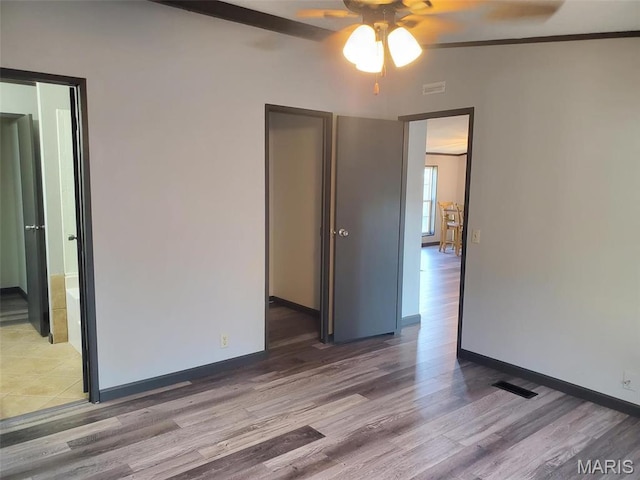 19983 Oak Dr, Carlyle, IL 62231 - unfurnished room featuring a ceiling fan, wood finished floors, and baseboards