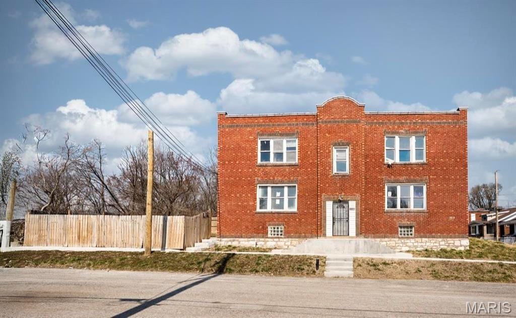 6201 Wabada Ave, Wellston, MO 63133 - view of front of house featuring brick siding and fence