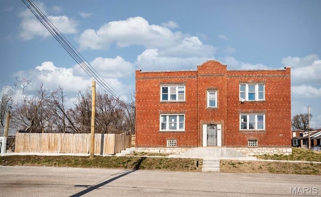 6201 Wabada Ave, Wellston, MO 63133 - view of front of house featuring brick siding and fence