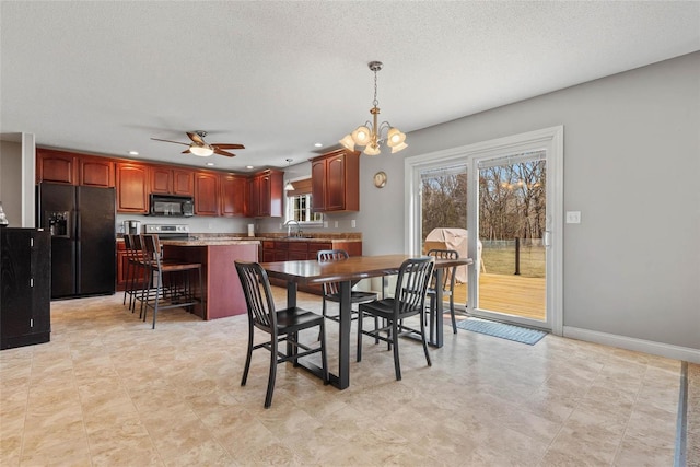 dining room with ceiling fan, a chandelier, recessed lighting, a textured ceiling, and baseboards