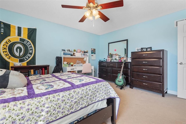 bedroom featuring light carpet and ceiling fan