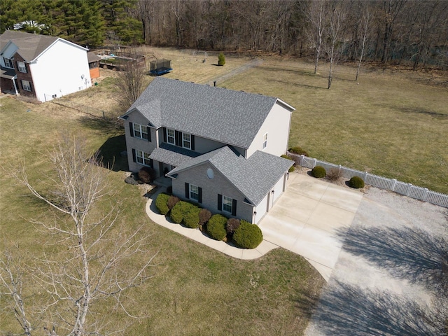 view from above of property with a heavily wooded area