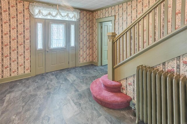 216 S Dickey St, Sparta, IL 62286 - foyer featuring radiator, wallpapered walls, baseboards, stairs, and ornamental molding
