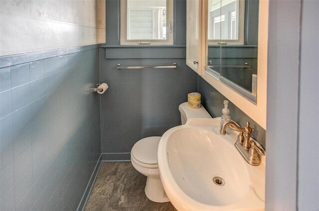 216 S Dickey St, Sparta, IL 62286 - bathroom with a sink, toilet, and tile walls