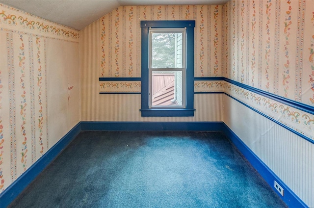 216 S Dickey St, Sparta, IL 62286 - carpeted spare room with vaulted ceiling, baseboards, and wallpapered walls