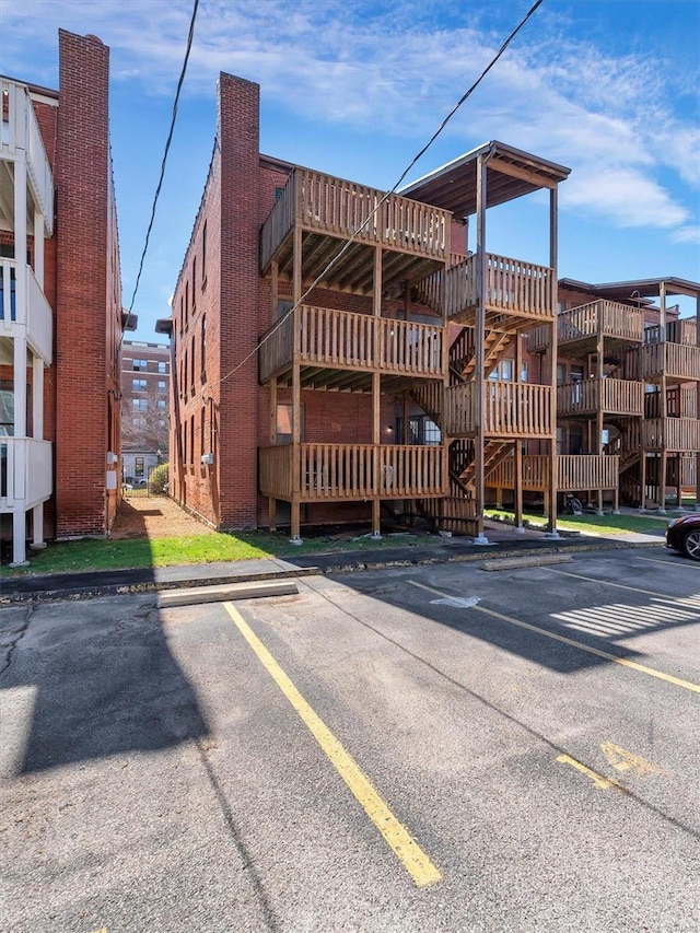 view of property featuring uncovered parking