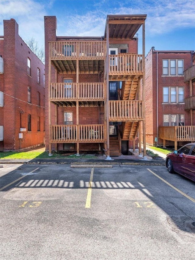 view of property featuring uncovered parking