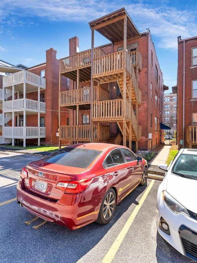 view of property featuring uncovered parking