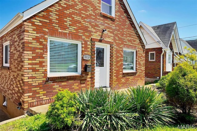 view of front of home featuring brick siding