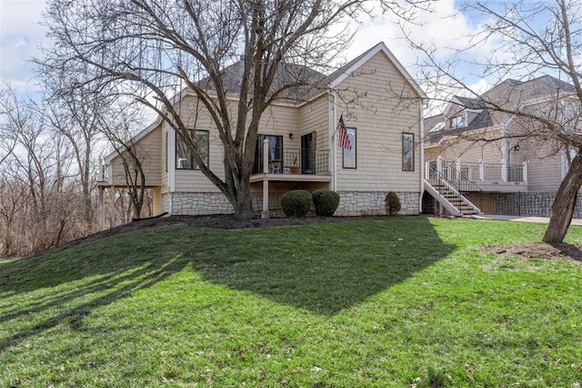 view of front facade with a front lawn and stairs
