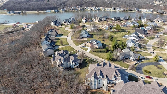aerial overview of property's location featuring a large body of water and nearby suburban area