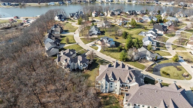 view of property location with a nearby body of water and nearby suburban area