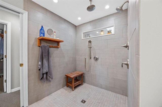 bathroom featuring a tile shower and recessed lighting