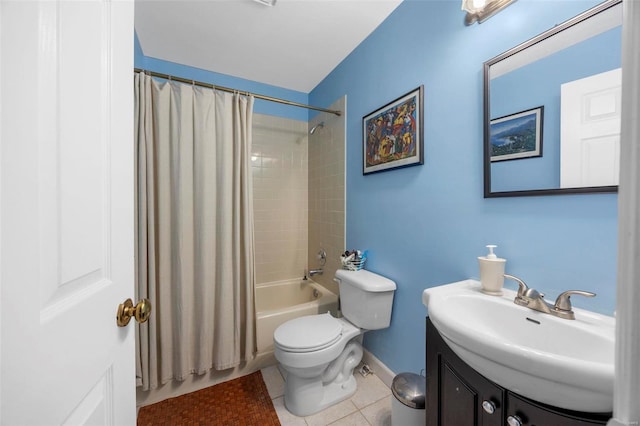 bathroom featuring tile patterned flooring, toilet, vanity, shower / tub combo with curtain, and baseboards