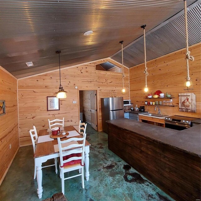 1432 Wayne 523, Wappapello, MO 63966 - dining room with vaulted ceiling, wooden walls, and concrete floors