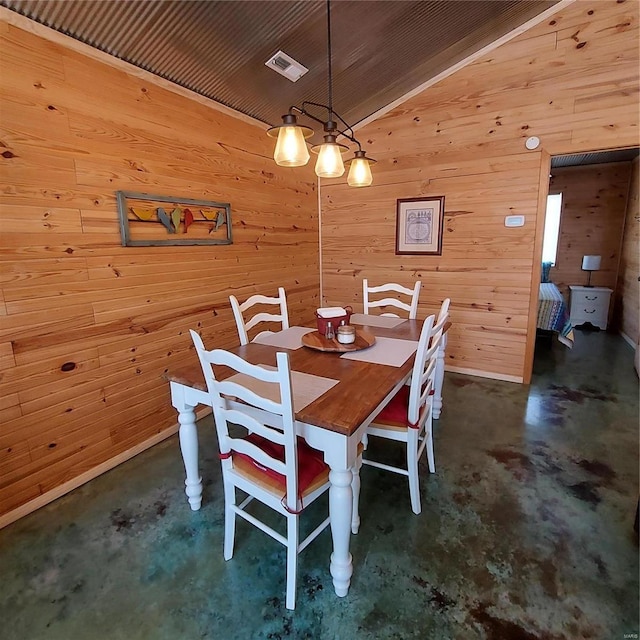 1432 Wayne 523, Wappapello, MO 63966 - dining room featuring unfinished concrete flooring, lofted ceiling, and wooden walls