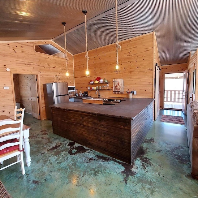1432 Wayne 523, Wappapello, MO 63966 - kitchen featuring concrete flooring, wood walls, dark countertops, lofted ceiling, and a sink